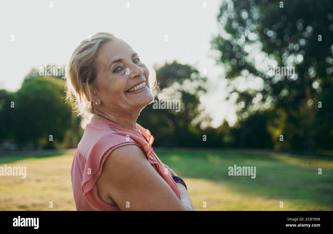 Happy grandmother enjoying sunset hi-res stock photography and images ...