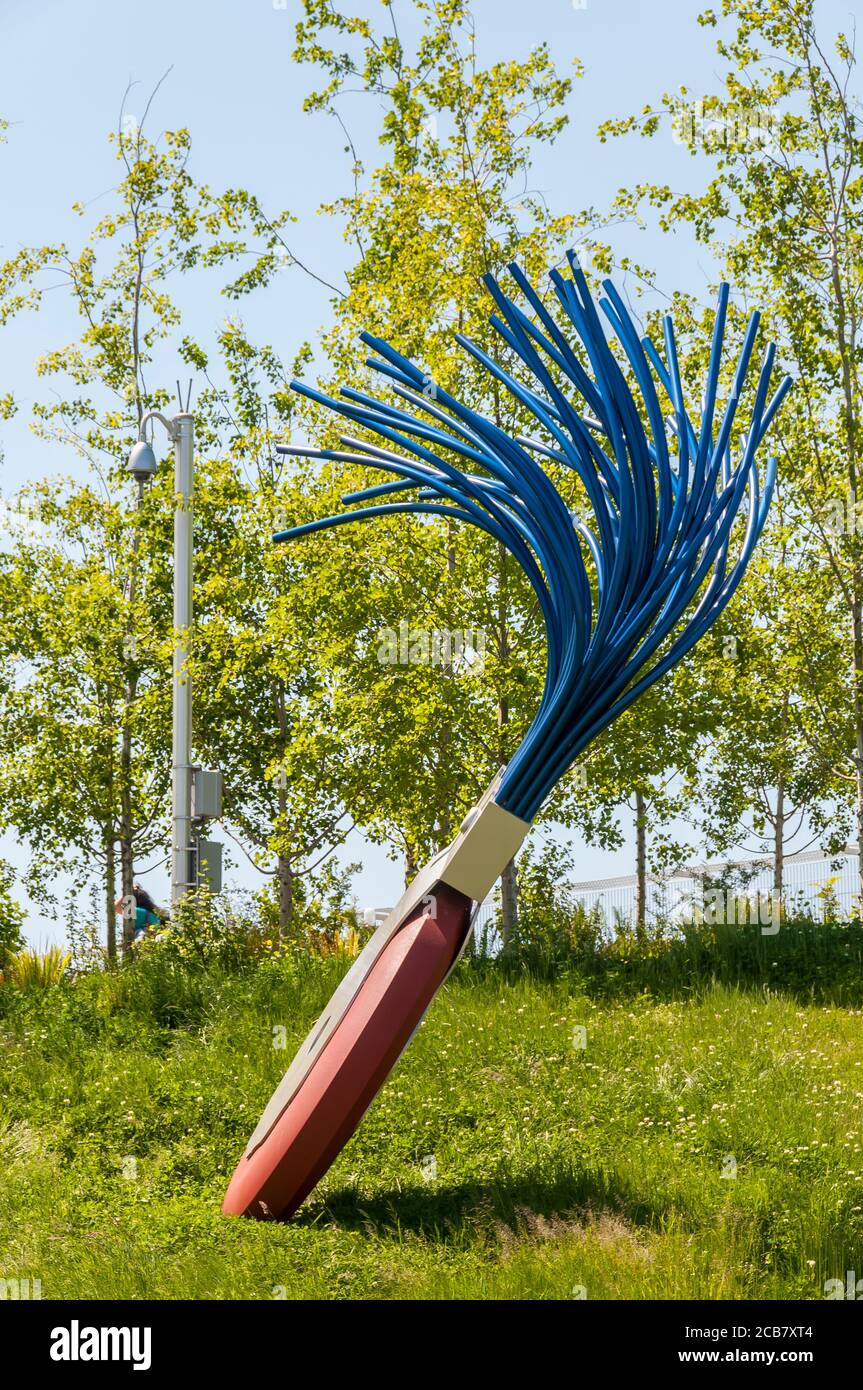 Large sculpture of wheel typewriter eraser with brush in Olympic