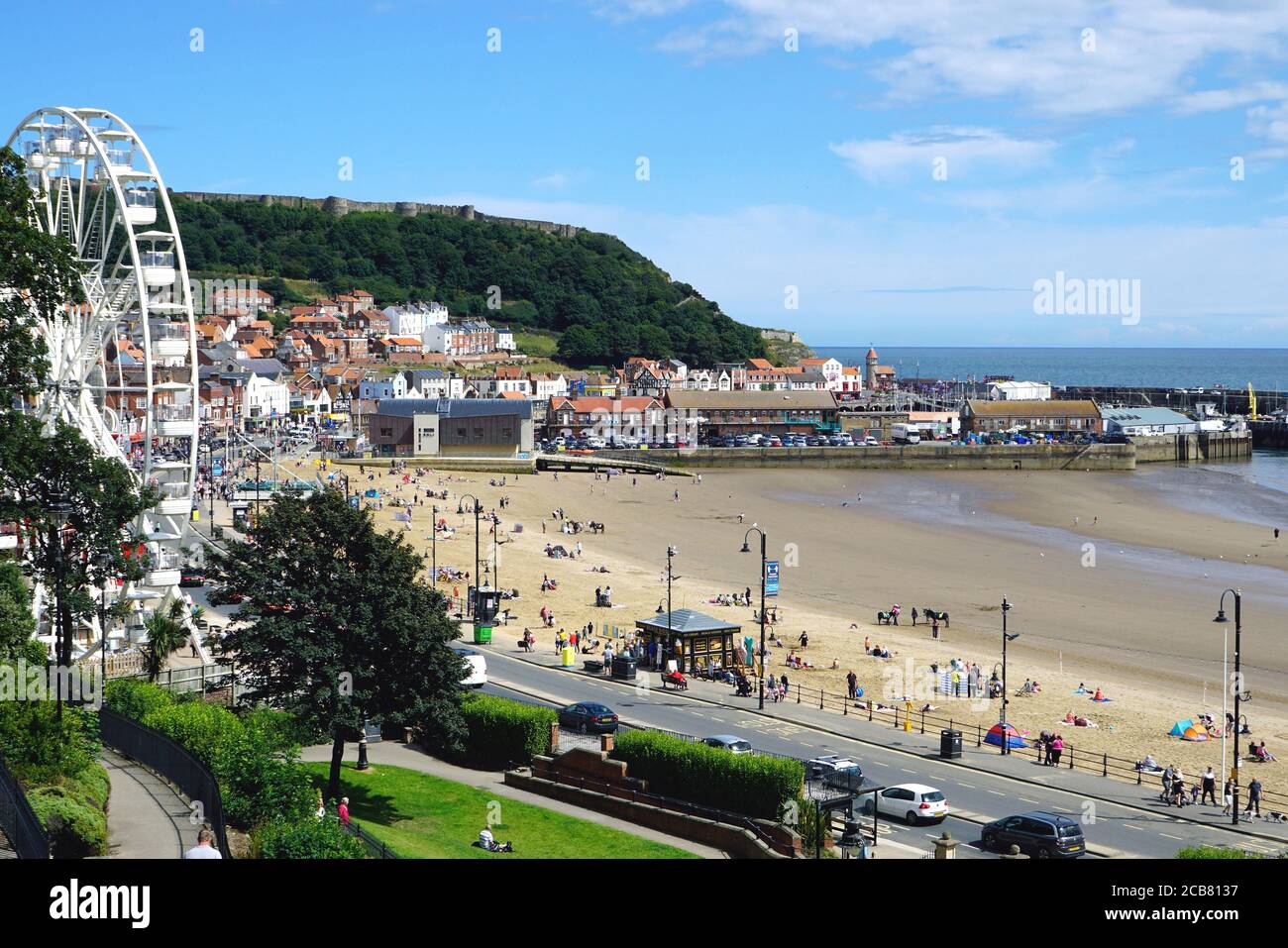 Scarborough, Yorkshire, UK. August 03, 2020. Tourists and holidaymakers enjoying the South beach at low tide after lockdown at Scarborough in Yorkshir Stock Photo