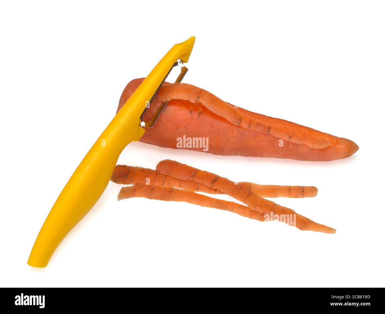 Yellow peeler, used to peel a carrot on white background. Knife, peeler for vegetables and fruits Stock Photo
