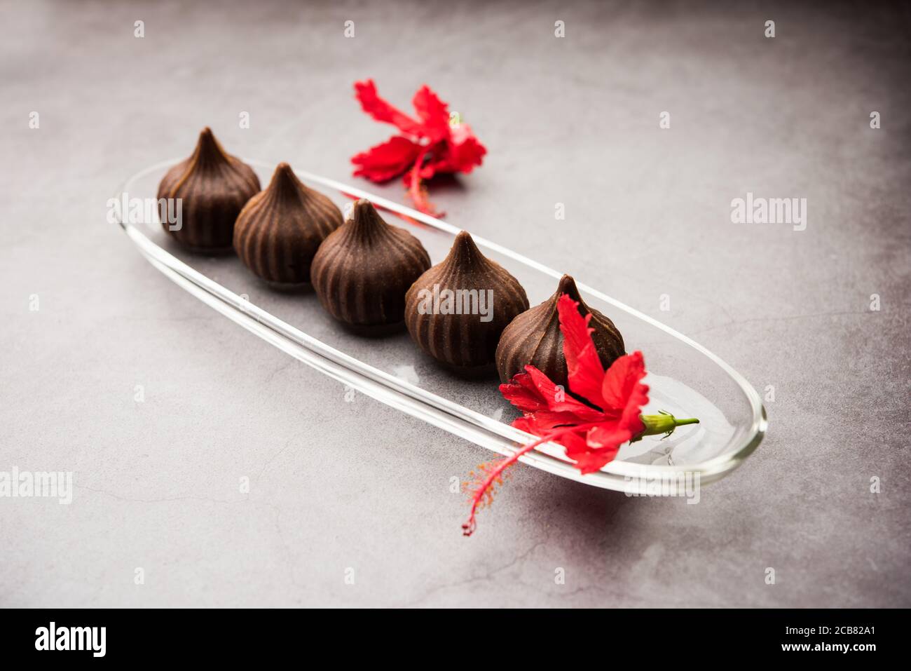 Clay Modak Chocolate Modak for Ganesh Chaturthi Puja or Ganesha festival Stock ...