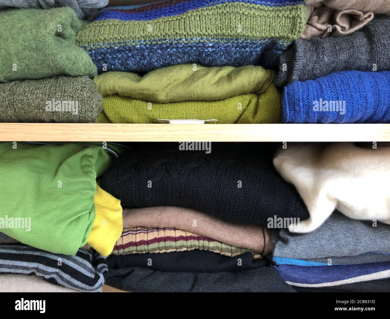 Close up clothing stack in wardrobe hires stock photography and images