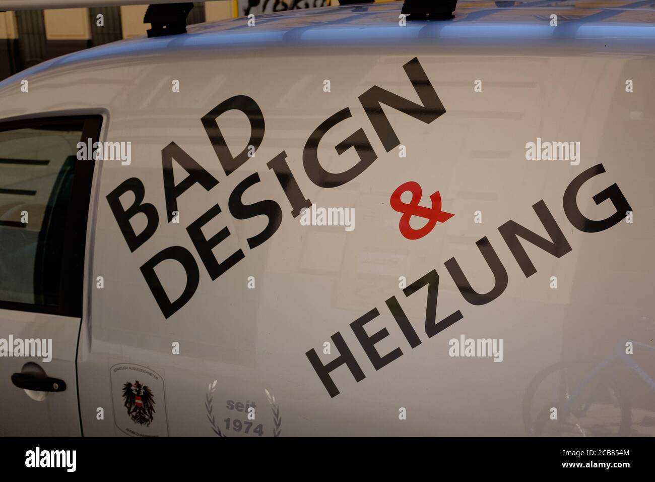 A white van with the caption 'Bad design and Heizung' business name written on the side Stock Photo