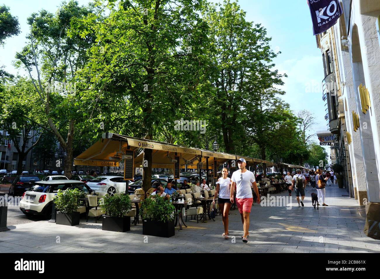 Königsallee, Germany's most popular luxury shopping boulevard, on a sunny day. This shopping street was completed between 1802 and 1804. Stock Photo