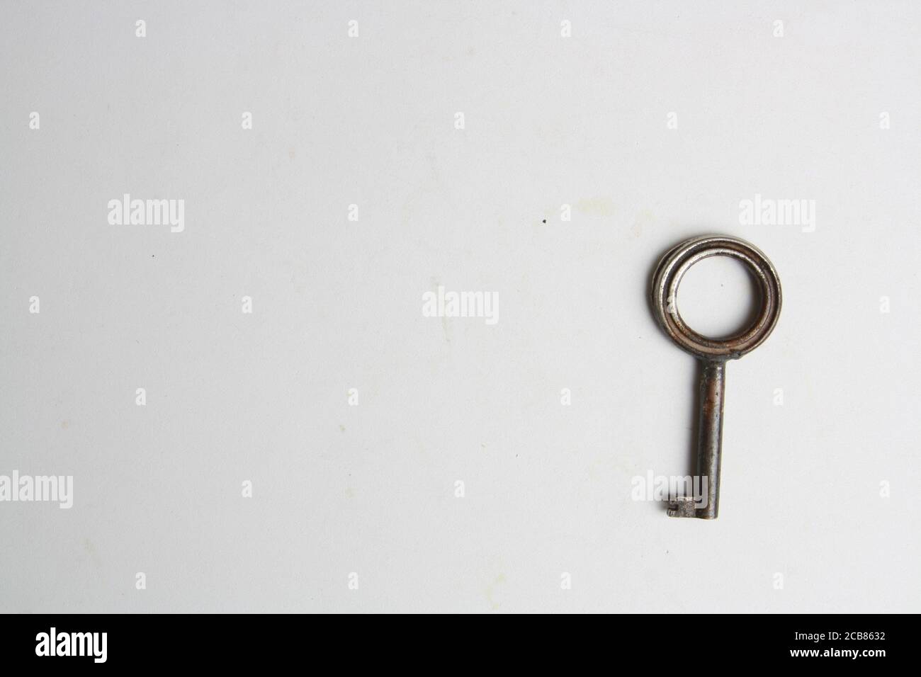 Old rusty key isolated on a white background Stock Photo - Alamy
