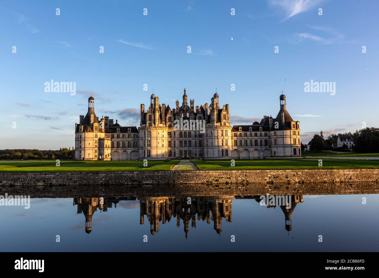 Reflection of Château de Chambord at sunset, Chambord, Loir-et-Cher, France, Stock Photo