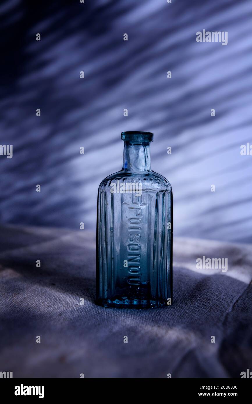 Old blue glass poison bottle Stock Photo Alamy
