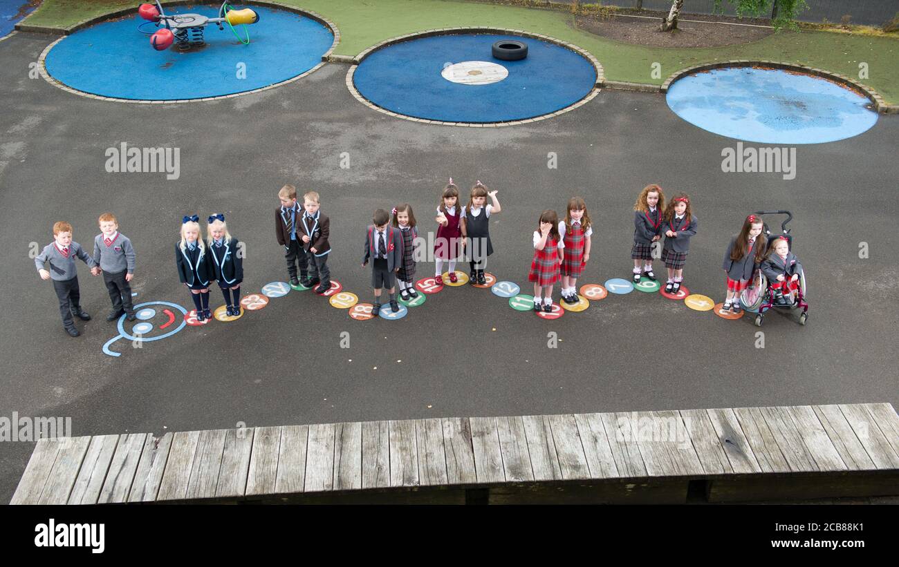 Port Glasgow, Scotland, UK. 11th Aug, 2020. Pictured: Eight sets of twins start school in Inverclyde Eight sets of twins are set to start their first day of school in Inverclyde. Names: (L - R) Connor & John Branchfield; Alice & Penny Beer; Benn & Josh Cairns; Lola & Malena Perez Malone; Aria & Isla McLaughlin; Eva & Iona Metcalf; Kali & Lianna Ptolomey. Credit: Colin Fisher/Alamy Live News Stock Photo