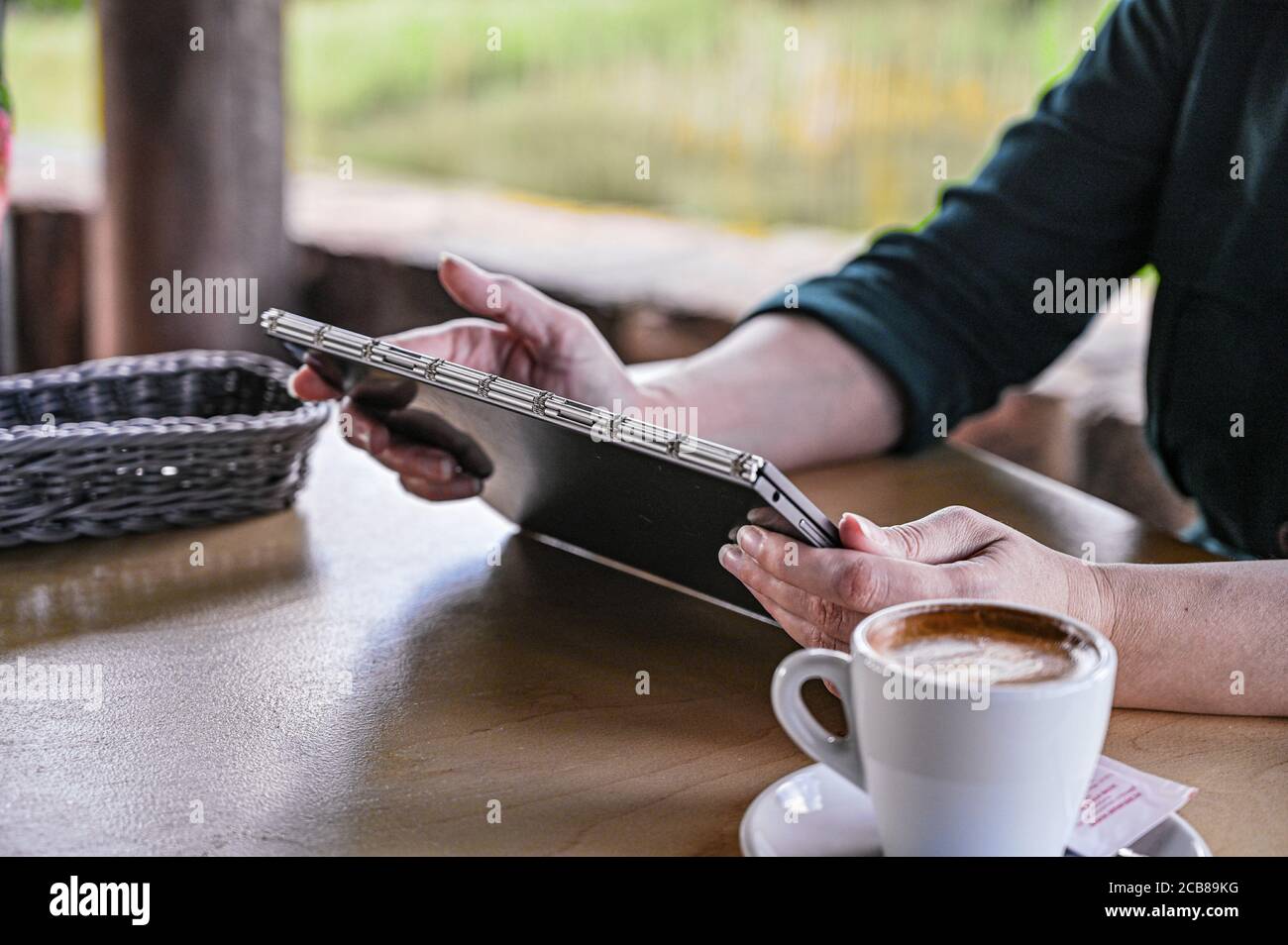 Customers Using Tablets Customer order food and drink, using tablet in a restaurant. Digital ...