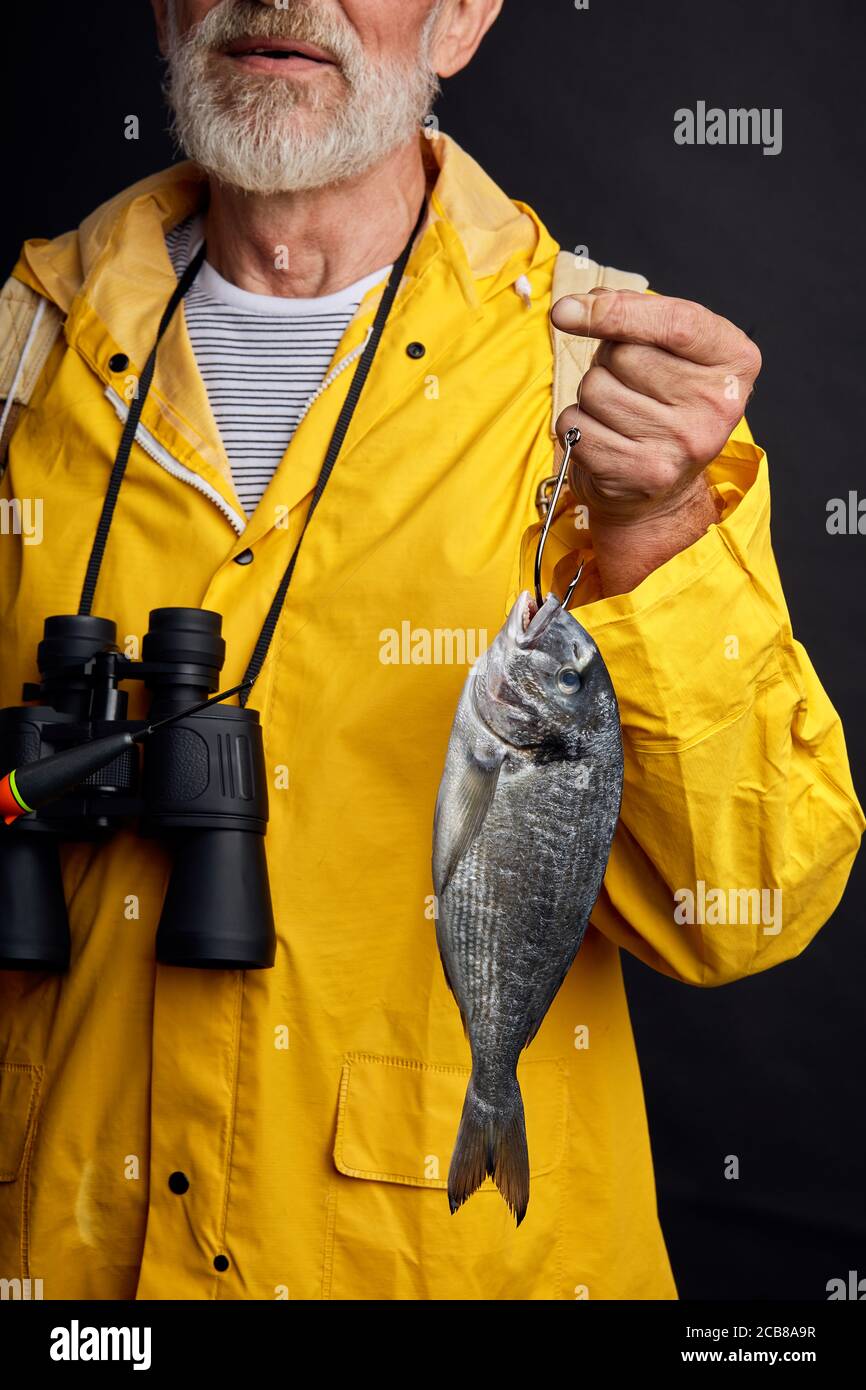 Person holding black and yellow fishing reel photo – Free Fishing