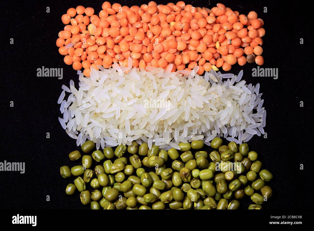 15 August India Independence Day concept, Indian flag made by grains isolated on black background. Indian National Flag tricolor from pulse. Stock Photo