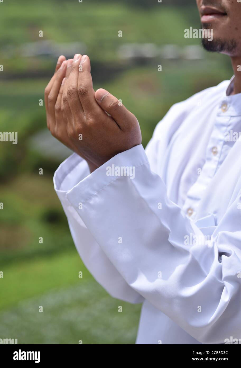 Religious muslim man praying hand. Stock Photo