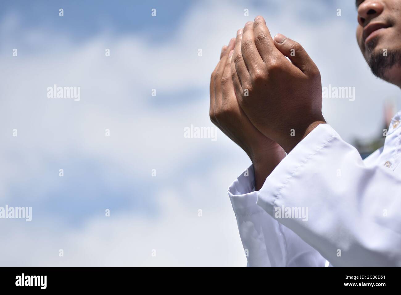 Religious muslim man praying hand. Stock Photo