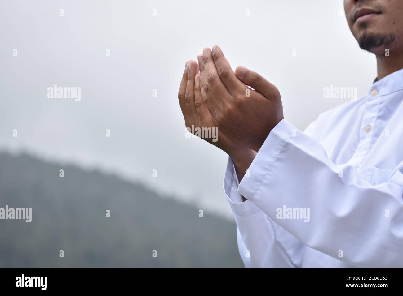 Religious muslim man praying hand Stock Photo - Alamy