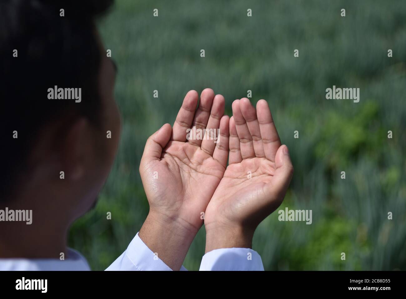 Religious muslim man praying hand. Stock Photo
