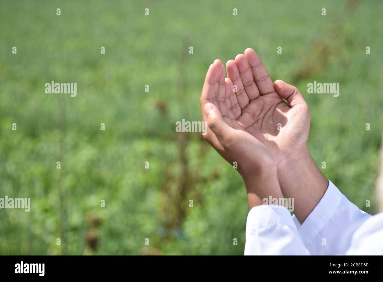 Religious muslim man praying hand. Stock Photo