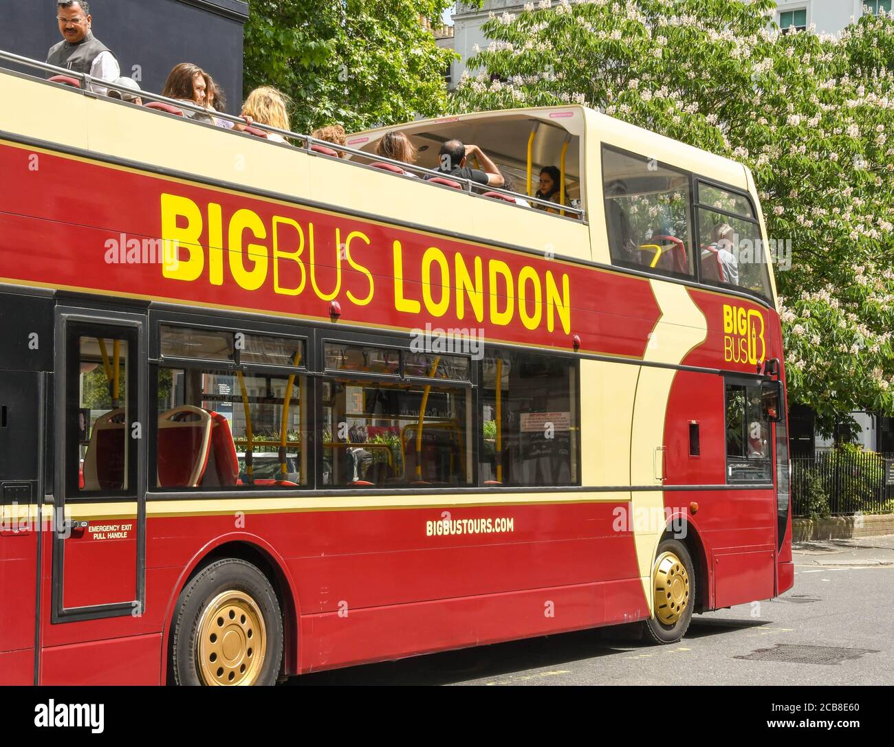 London, England - June 2018: City sightseeing bus operated by BigBus London with tourists on the upper deck. Stock Photo