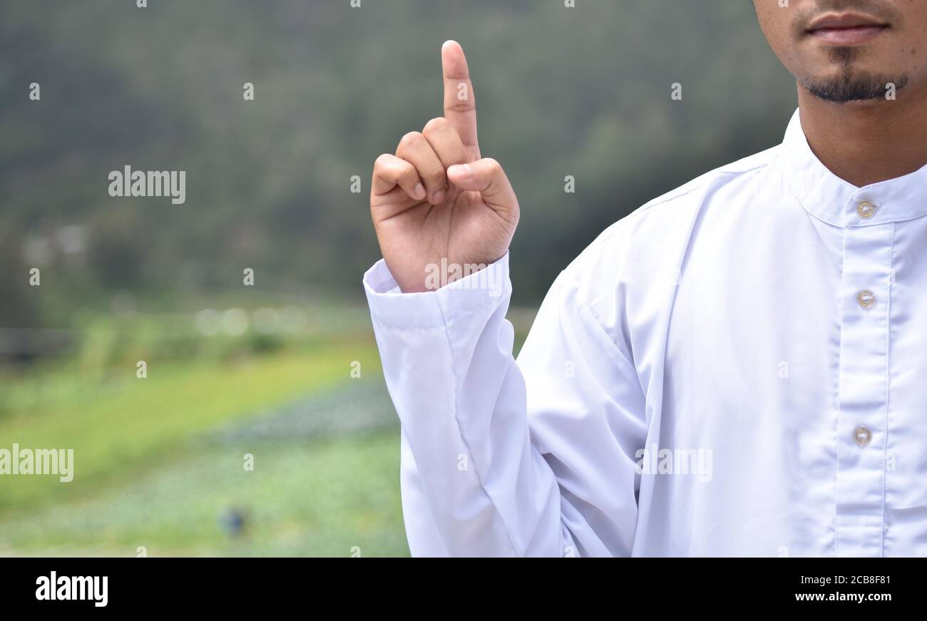 a man's hand with a tawhid symbol Stock Photo