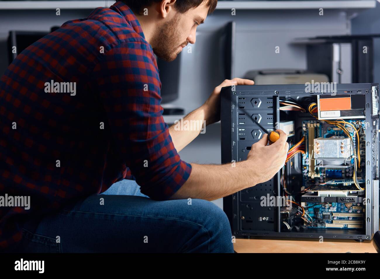 professional staff disassembling and cleaning your old computer, close ...