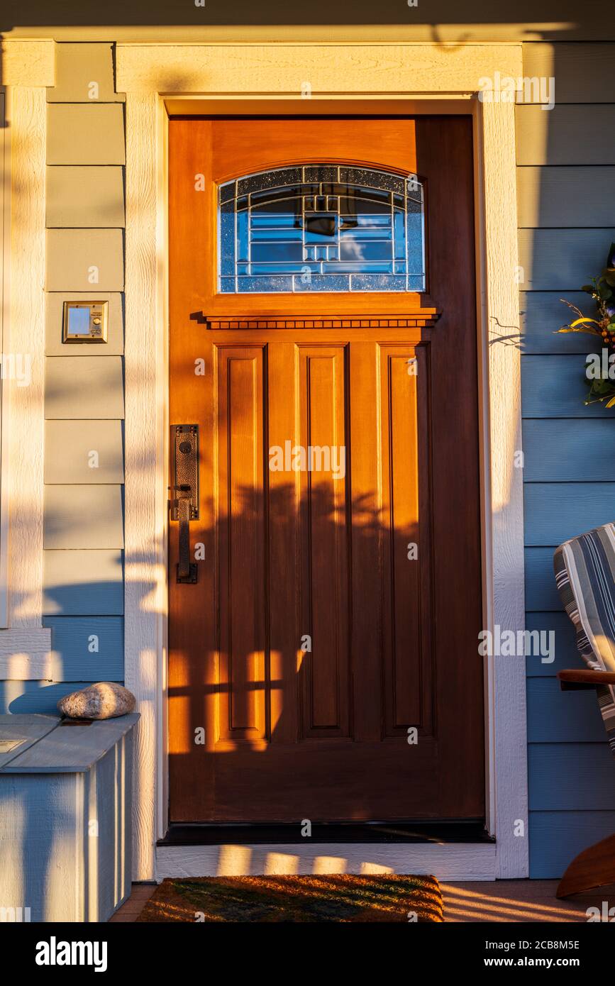 Wooden front door with leaded glass window; Craftsman Style residential