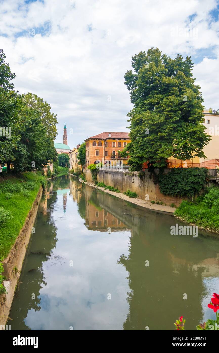Vicenza, Italy - August 12, 2019: Flowered balcony of Monte Furo in Vicenza with a view of Retrone river and the clock tower in the distance Stock Photo