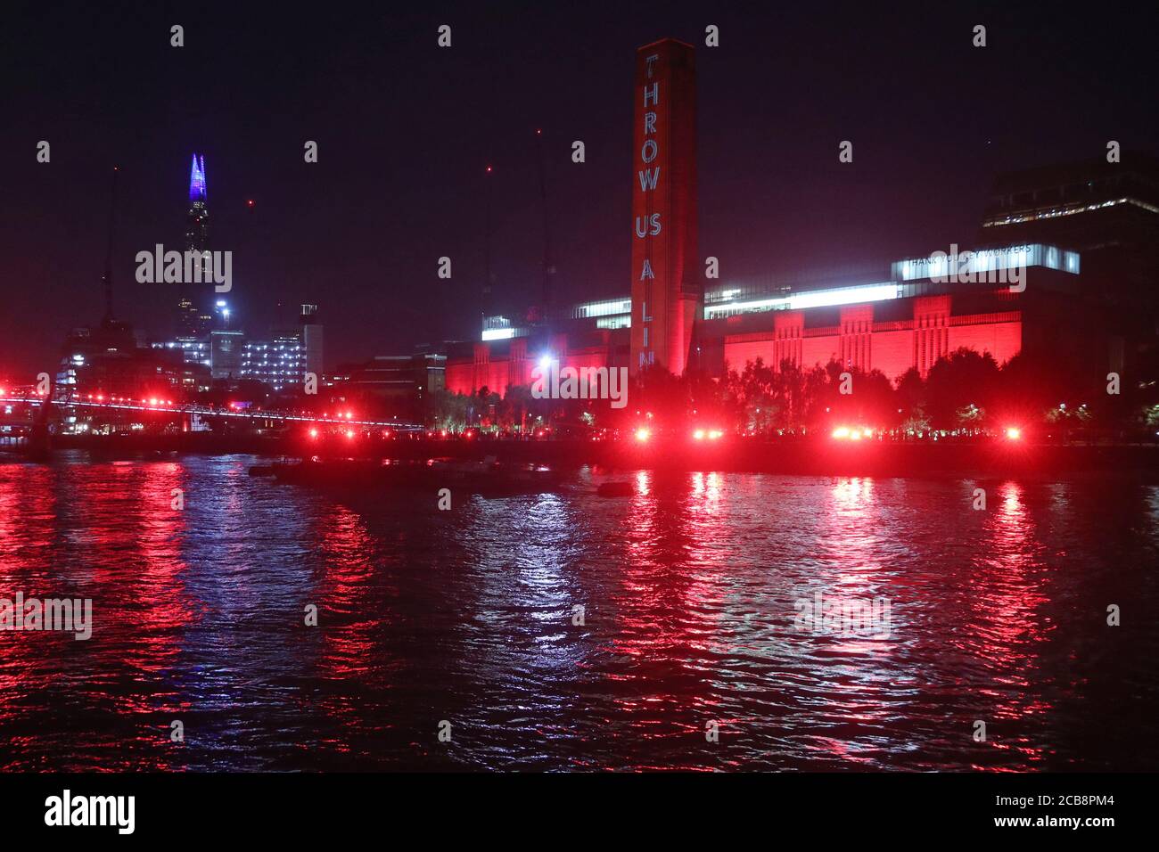 The Tate Modern lit up in red to raise awareness for over a million jobs in the entertainment industry that are at risk of being lost without financial support from the government following the coronavirus outbreak. Stock Photo