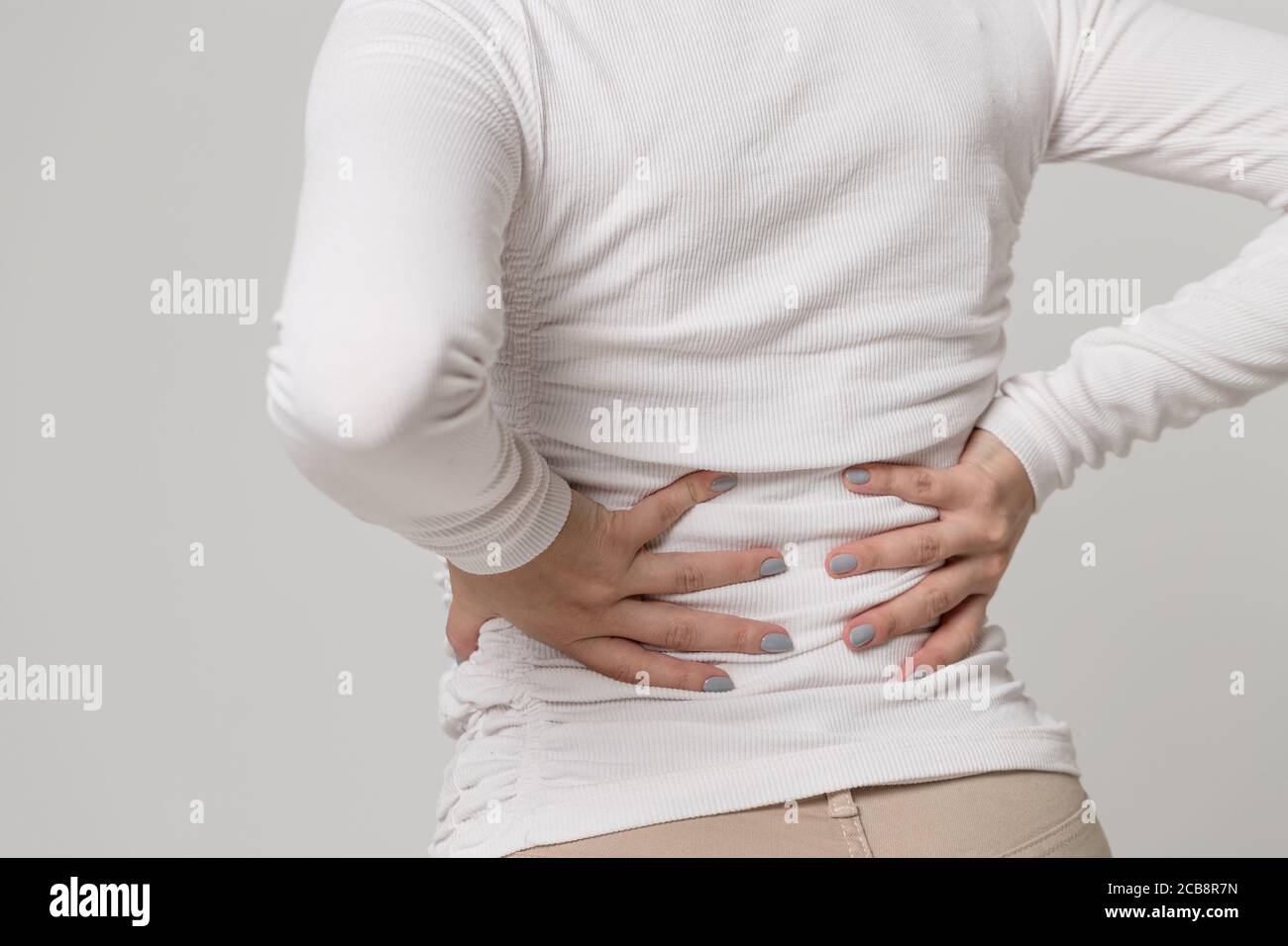 https://c8.alamy.com/comp/2CB8R7N/closeup-view-of-woman-having-pain-muscle-or-chronic-nerve-pain-in-her-back-after-work-isolated-diseases-of-spine-scoliosis-osteoporosis-2CB8R7N.jpg