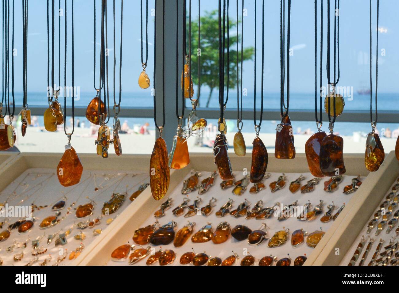 Amber jewellery for sale made of Baltic Amber at a stall next to the beach in Sopot, Poland Stock Photo