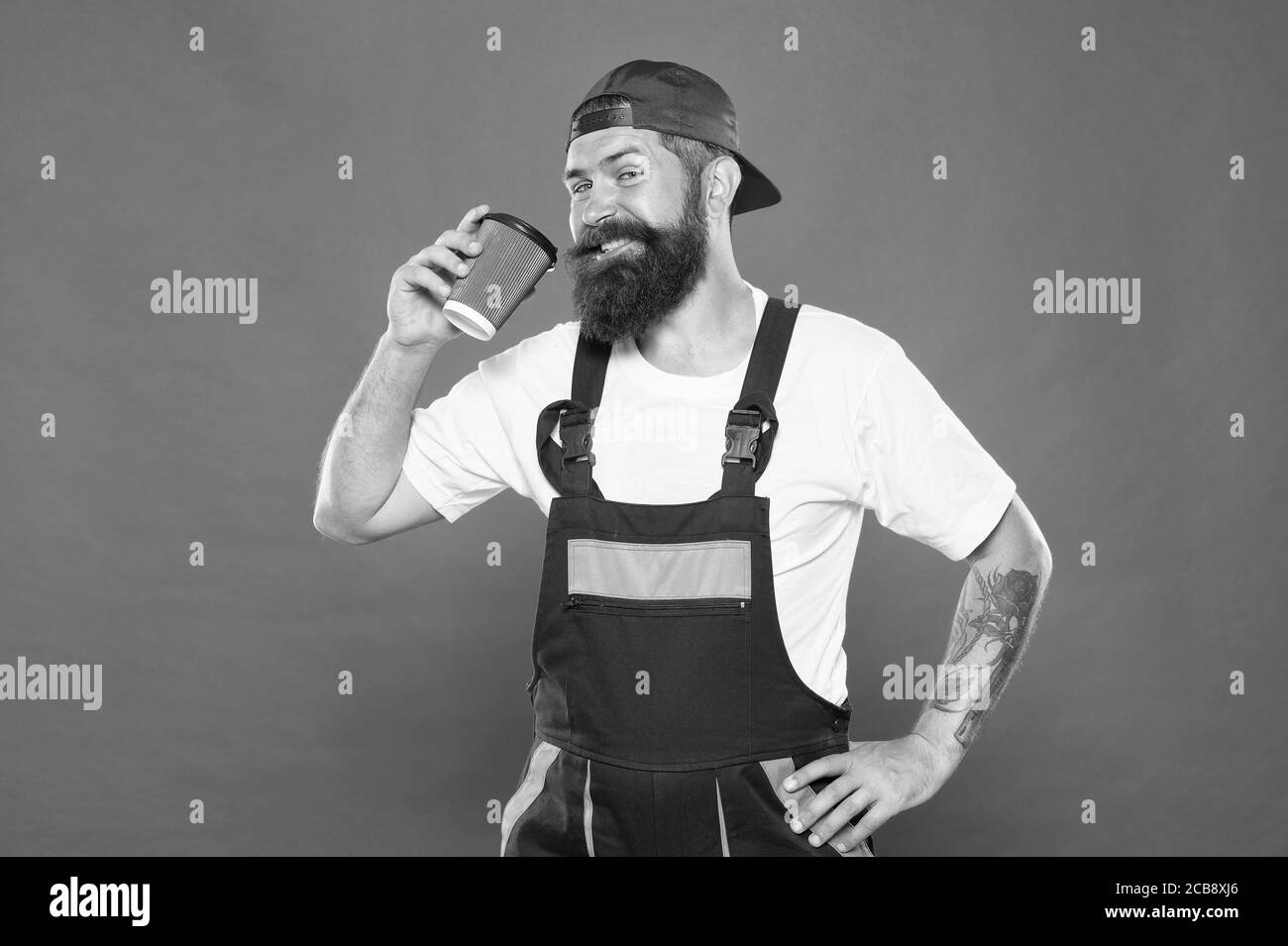 happy and cheerful barista. take away coffee. man drink coffee to go