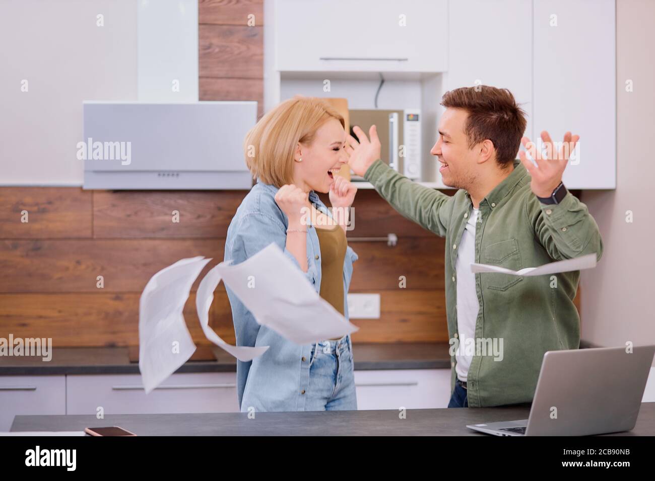 cheerful excited woman and man happy after joint discussion of finance