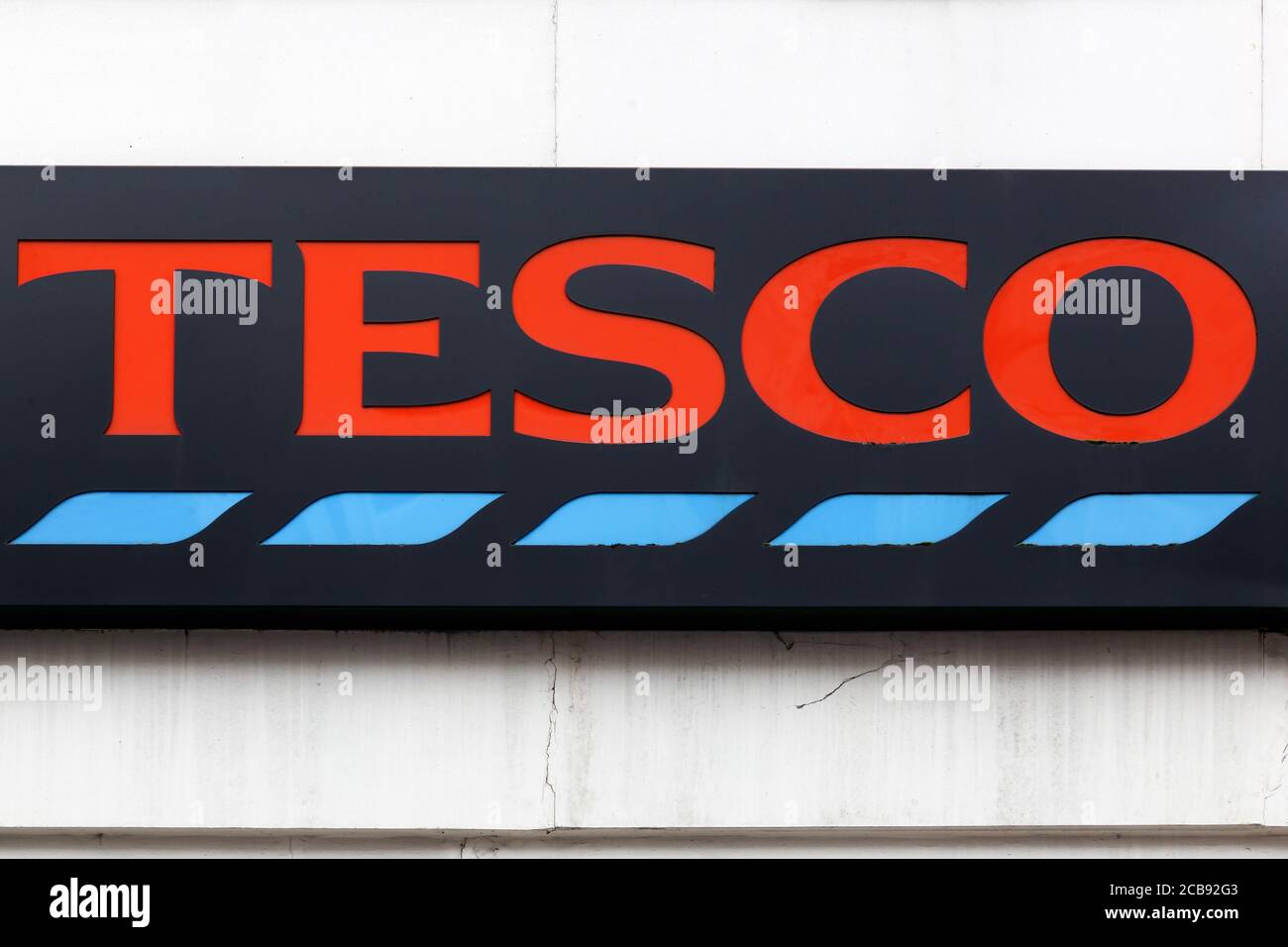 London, United Kingdom - September 25, 2019: Tesco logo on a wall. Tesco is a British multinational groceries and general merchandise retaile Stock Photo