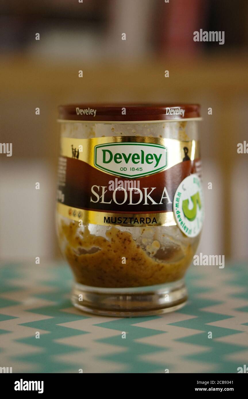 https://c8.alamy.com/comp/2CB9341/poznan-poland-jul-30-2020-polish-develey-sweet-mustard-in-a-opened-glass-jar-on-a-table-in-soft-focus-background-2CB9341.jpg