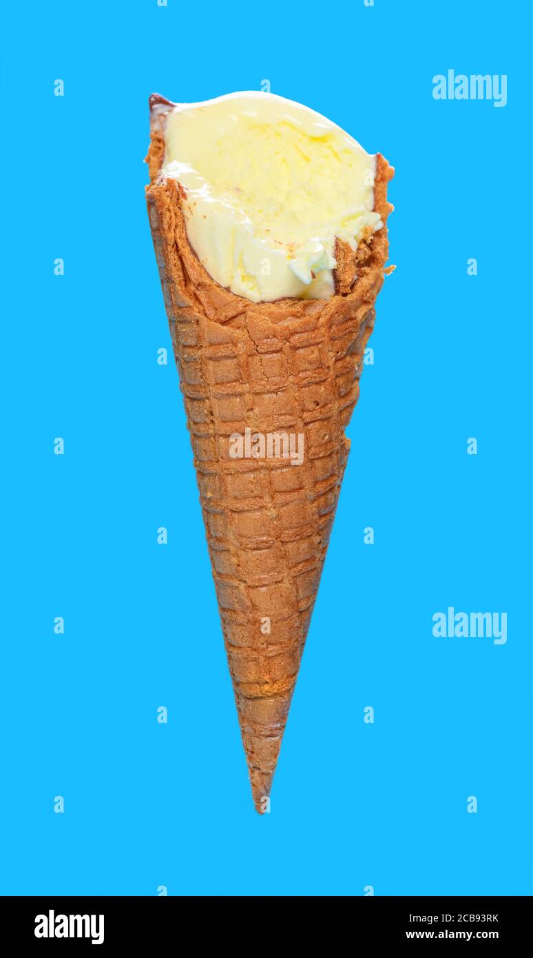 Side View Vanilla Flaovr Ice Cream Cone With Couple Of Bites On A Blue Background Stock Photo Alamy