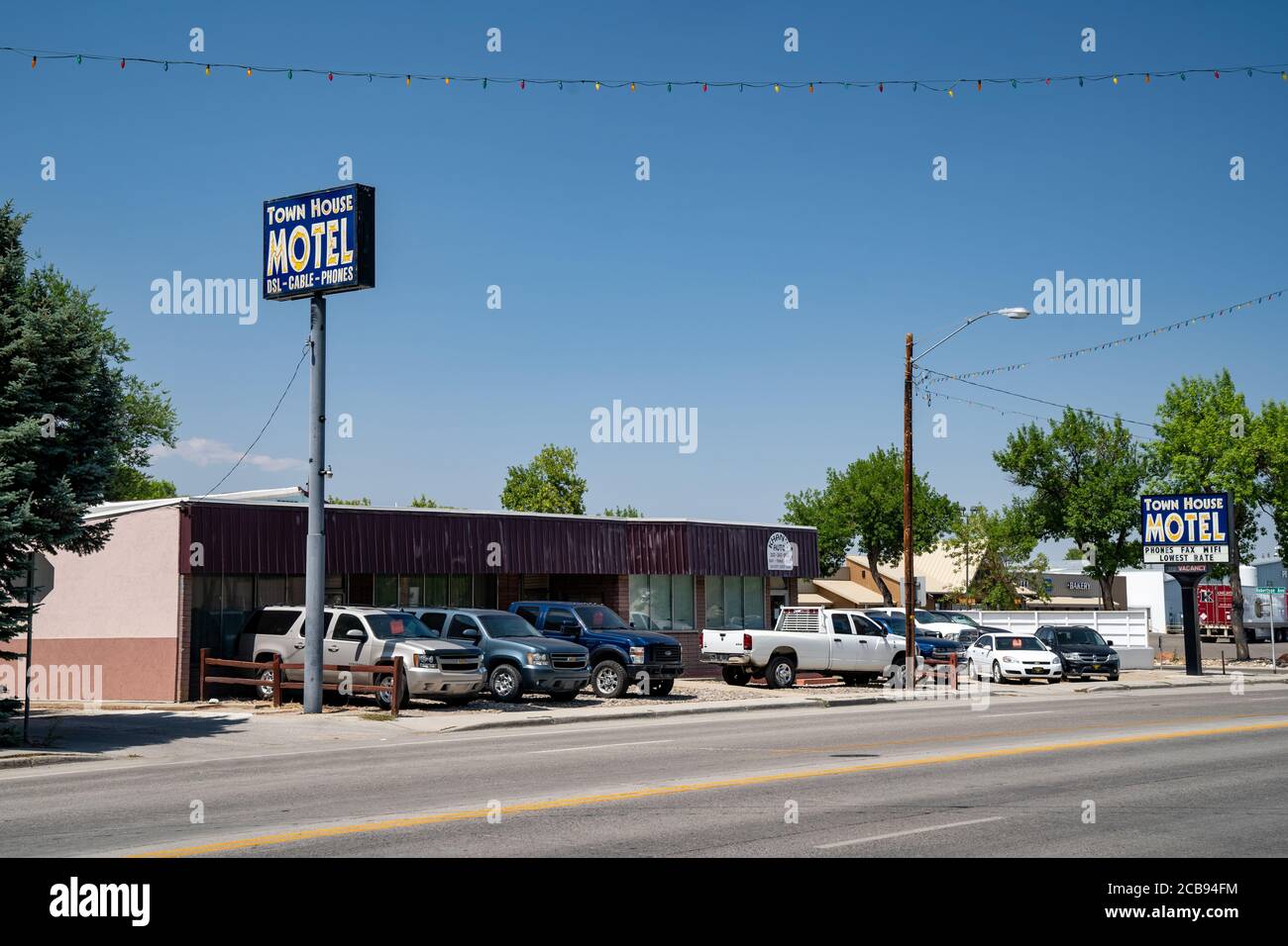 Worland, Wyoming - July 25, 2020: Sign for the Town House Motel, offering outdated amenities such as DSL, landline phones, and fax machines Stock Photo
