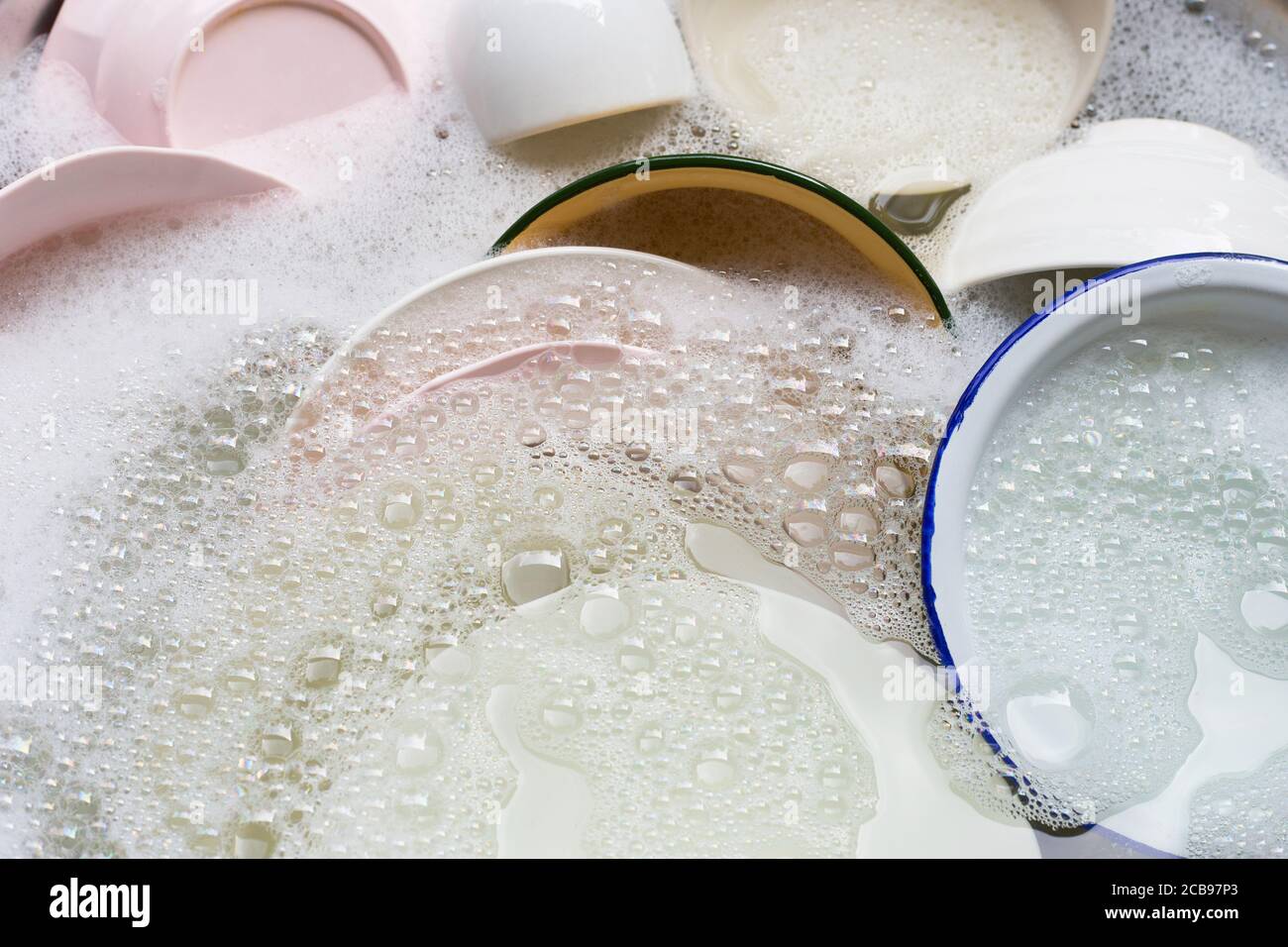 Washing dishes, Close up of utensils soaking in kitchen sink Stock Photo Alamy