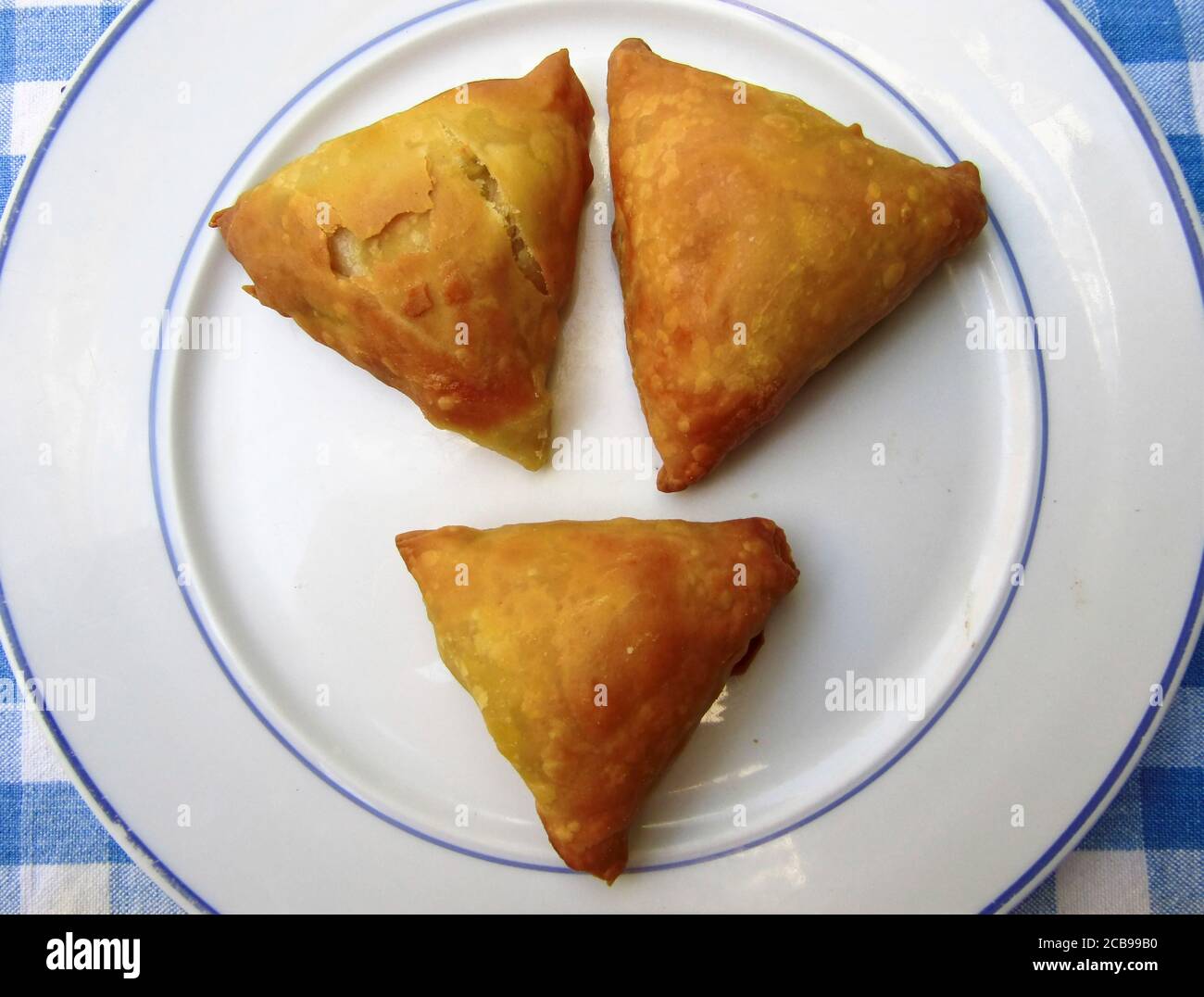 Greek Cuisine. Triangle Shaped Kalitsounia Pies with Spinach and Cheese