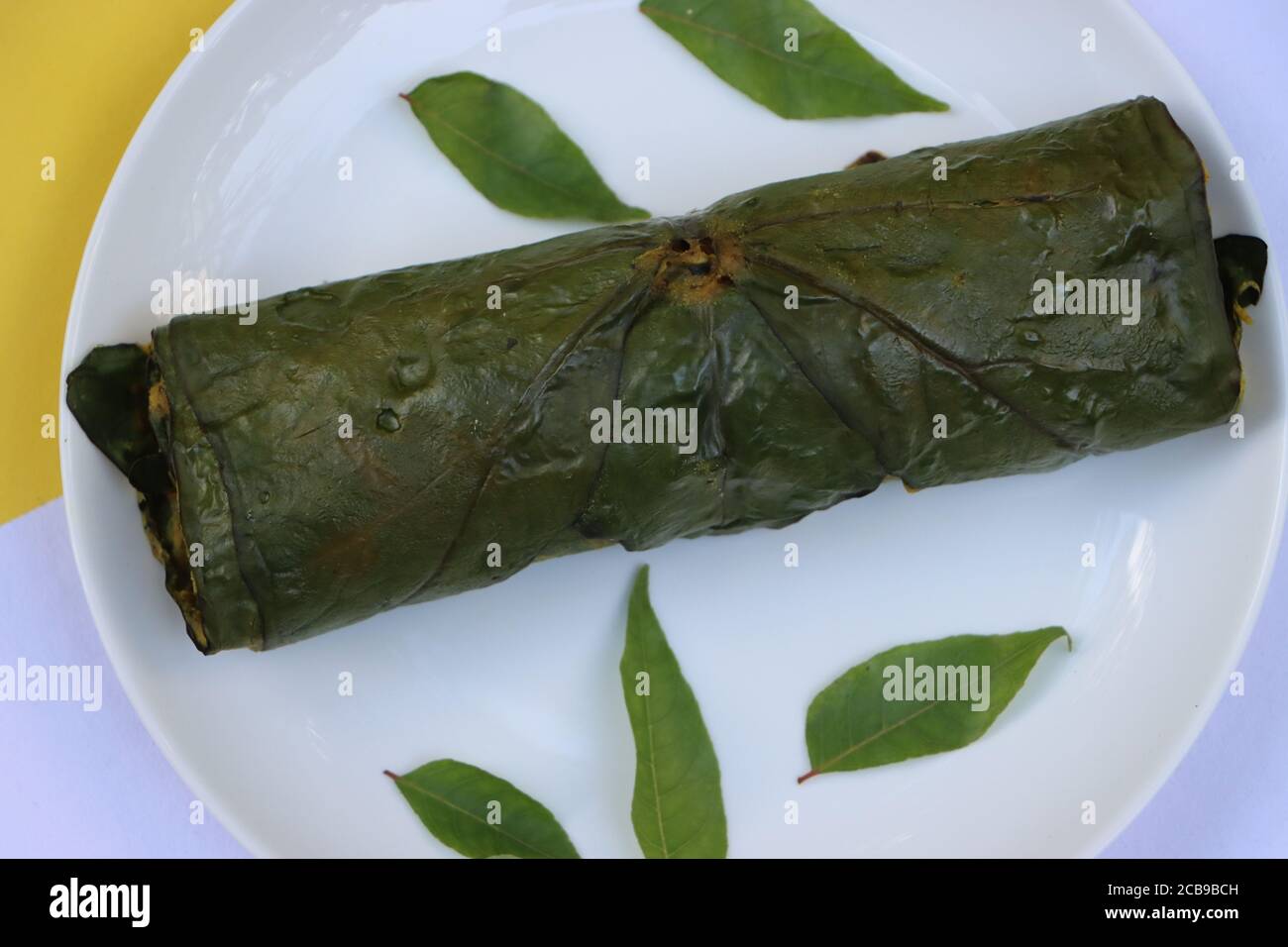 Patra or Paatra or Alu Vadi or Alu wadi is a popular maharashtrian and Gujarati snack made using colocasia leaves, gram flour and flavourings spices Stock Photo