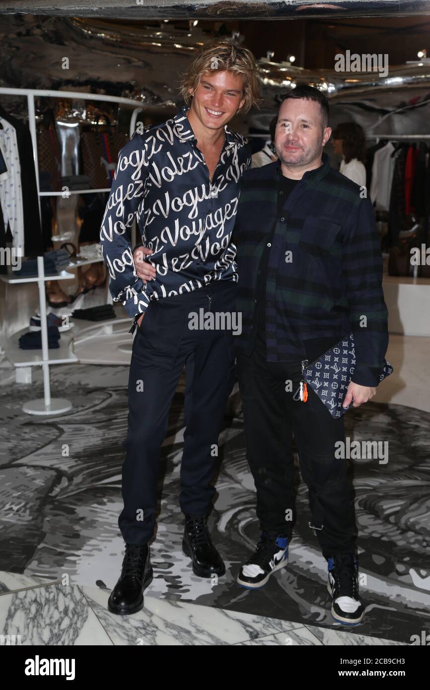 Jordan Barrett (Model & Actor) and Kim Jones (Louis Vuitton Men's Artistic  Director) at the opening of the first Louis Vuitton men's pop up store  Stock Photo - Alamy