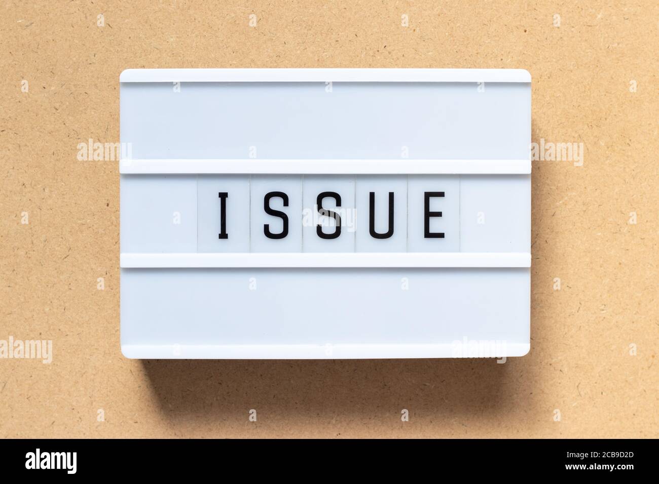 White lightbox with word issue on wood background Stock Photo