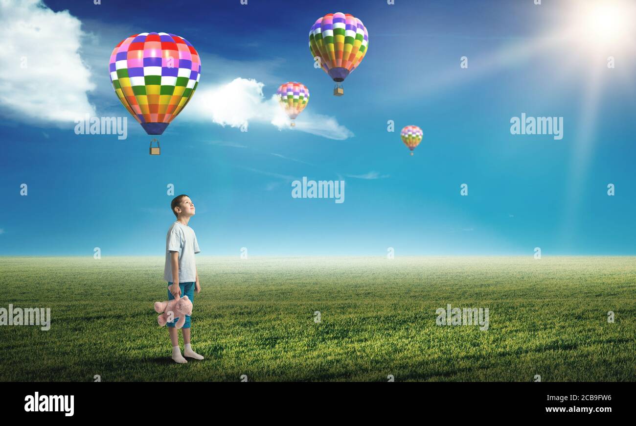 Boy with bear toy Stock Photo - Alamy
