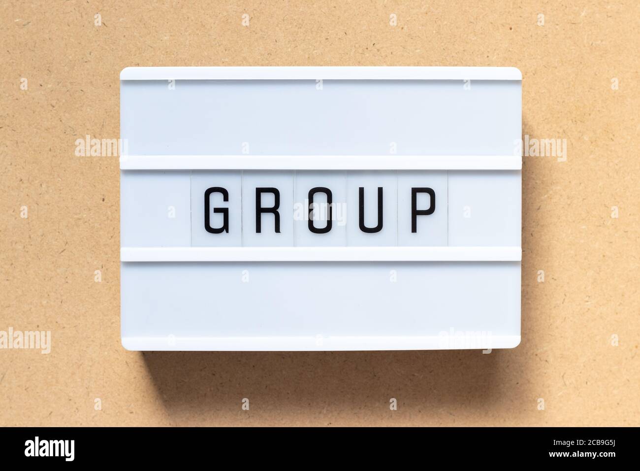 White lightbox with word group on wood background Stock Photo
