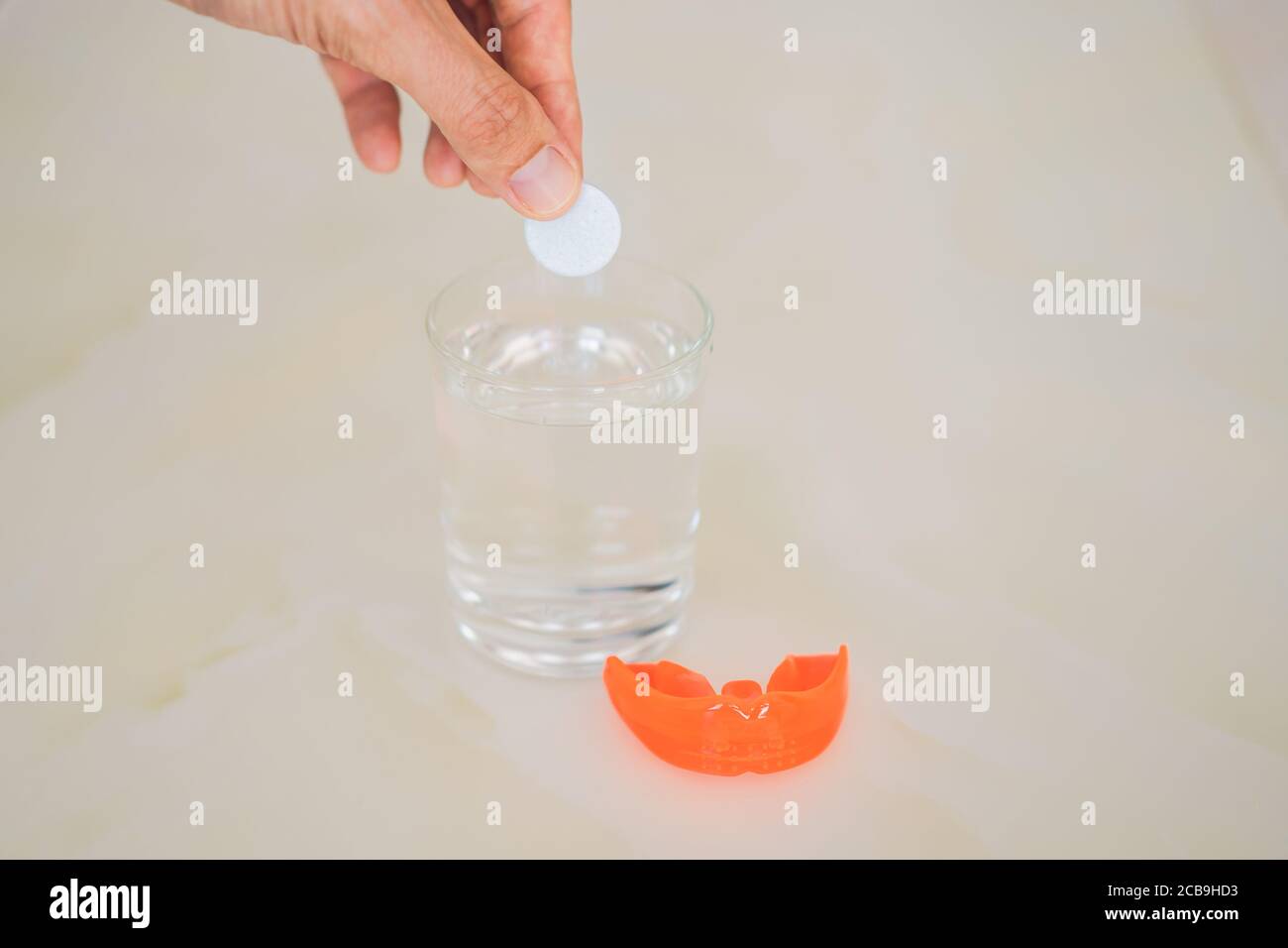 Dental mouthpiece cleaning tablet in a glass Stock Photo Alamy