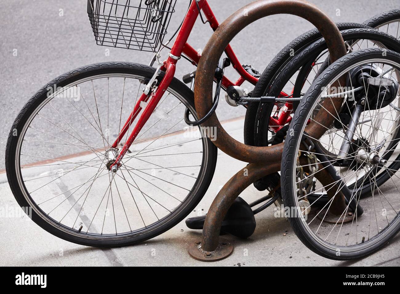 Close up picture of locked bicycle wheels, New York City, USA Stock
