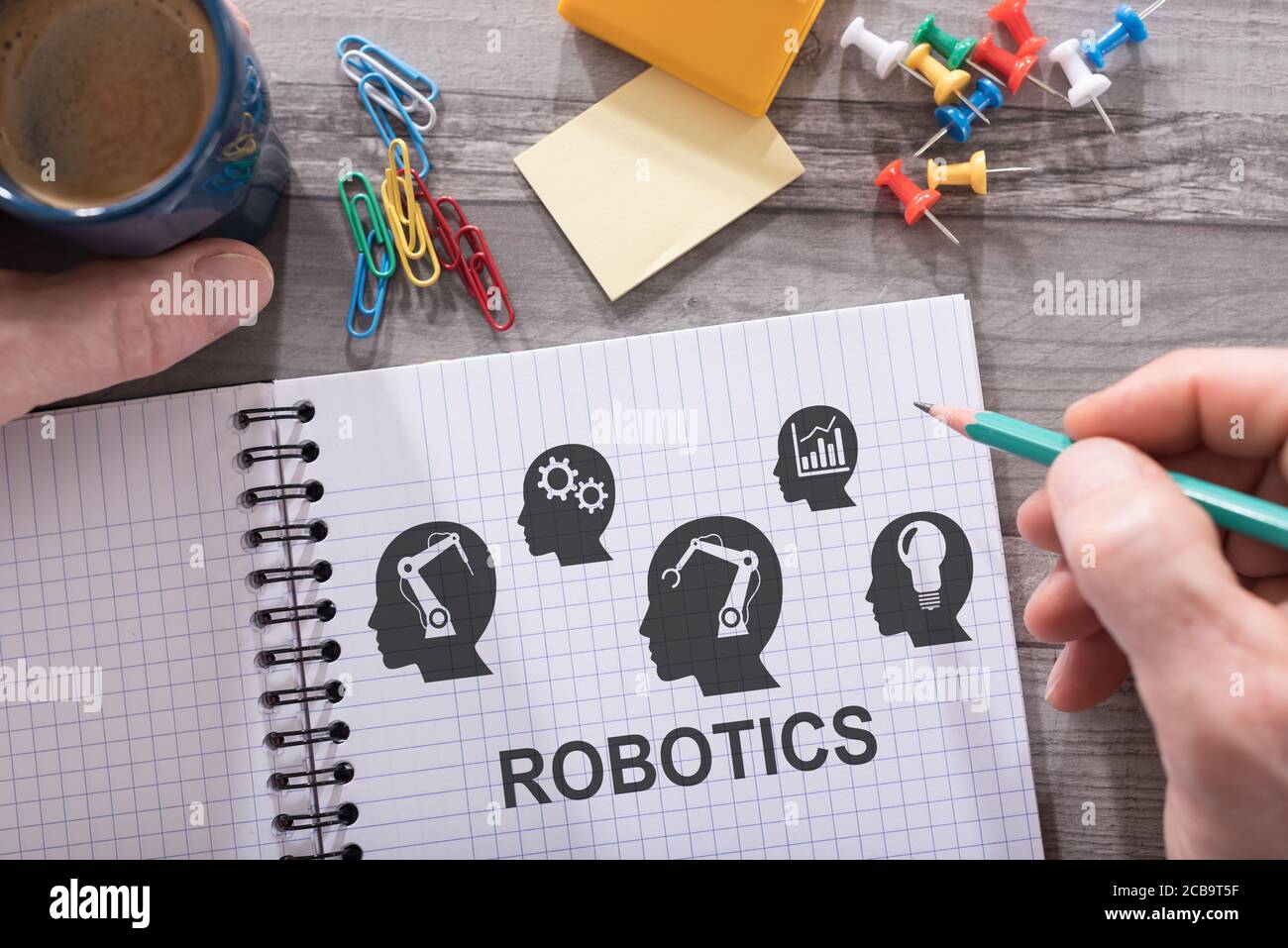 Robotics concept drawn on a notepad placed on a desk Stock Photo