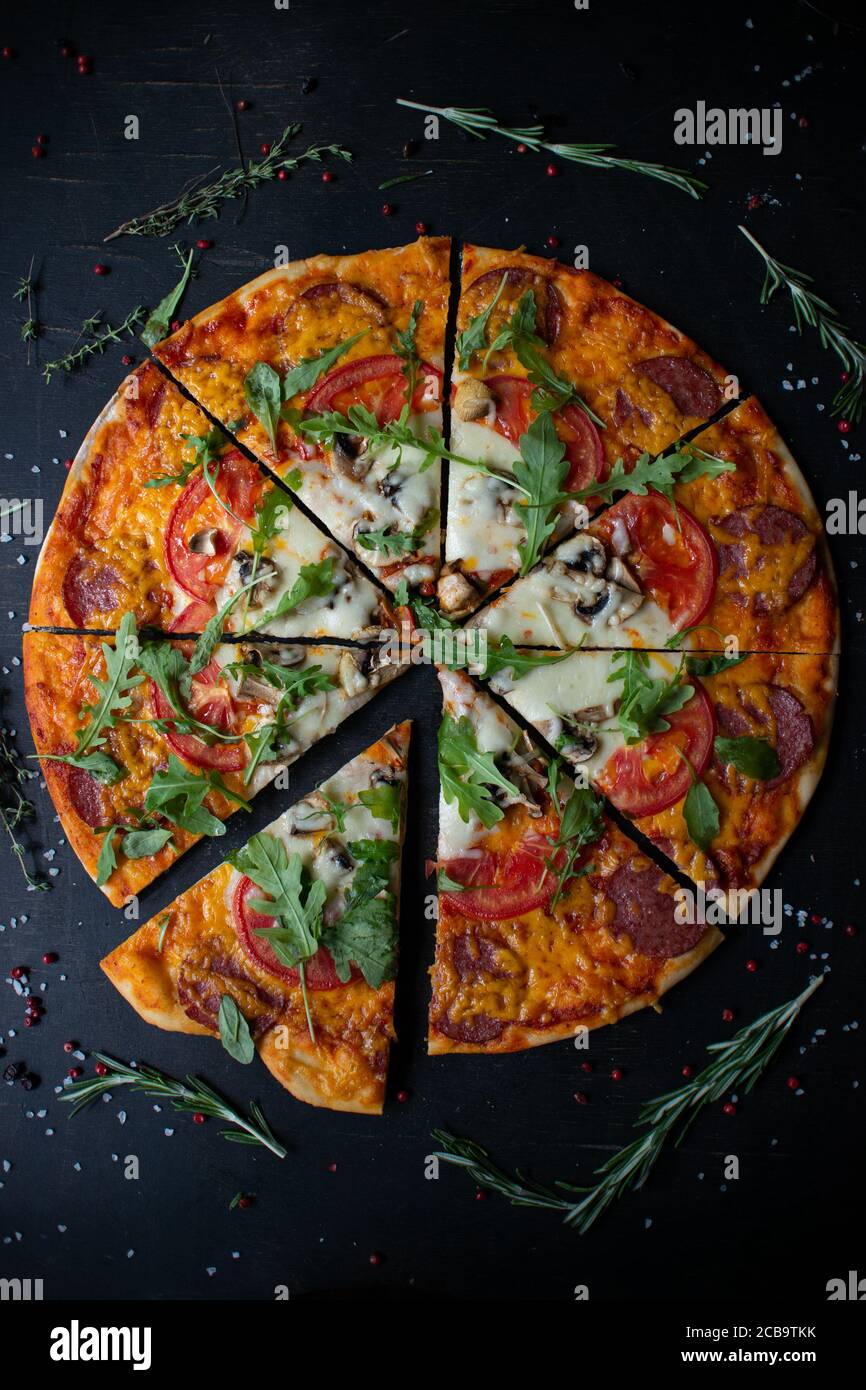 Traditional italian pizza. Cut into slices delicious fresh pizza with ...