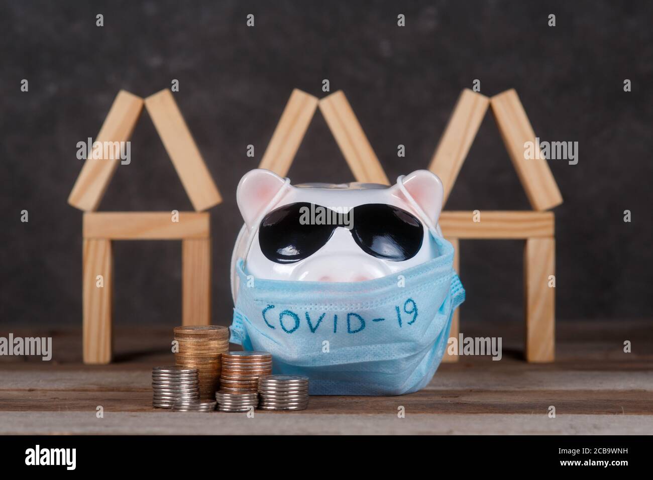 pandemic real estate crisis. masked piggy bank Stock Photo