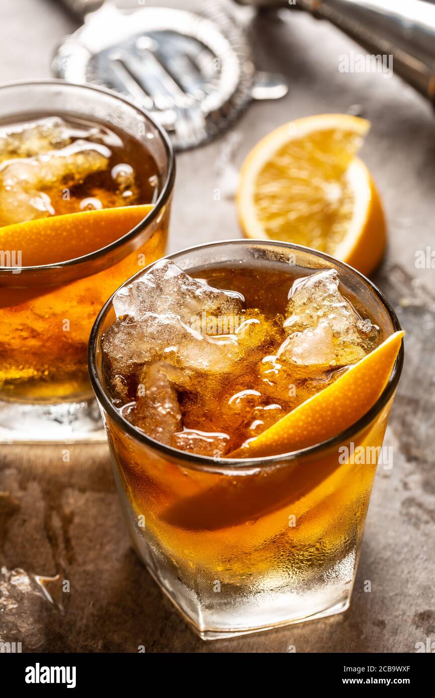 Cocktail Old fashioned Negroni with orange on the bar counter Stock Photo