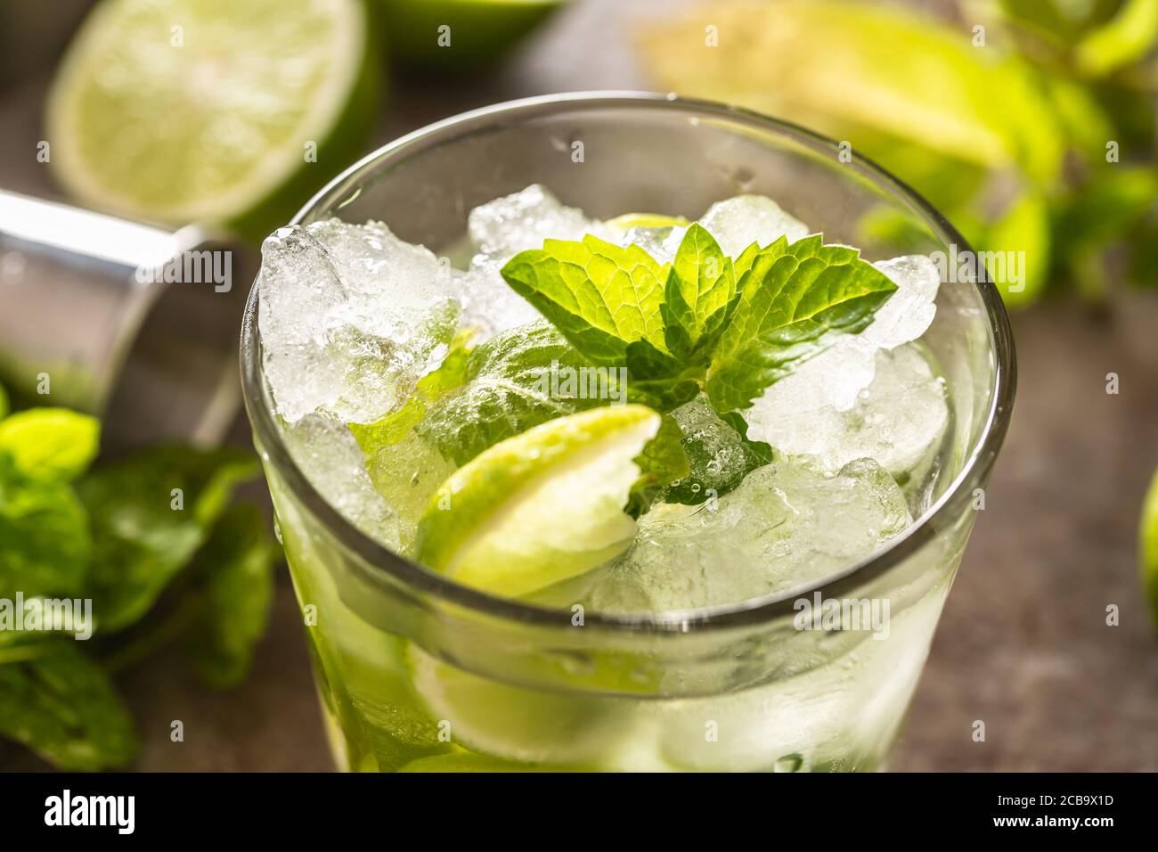 Mojito cocktail drink with white rum lime mint herbs and soda on the