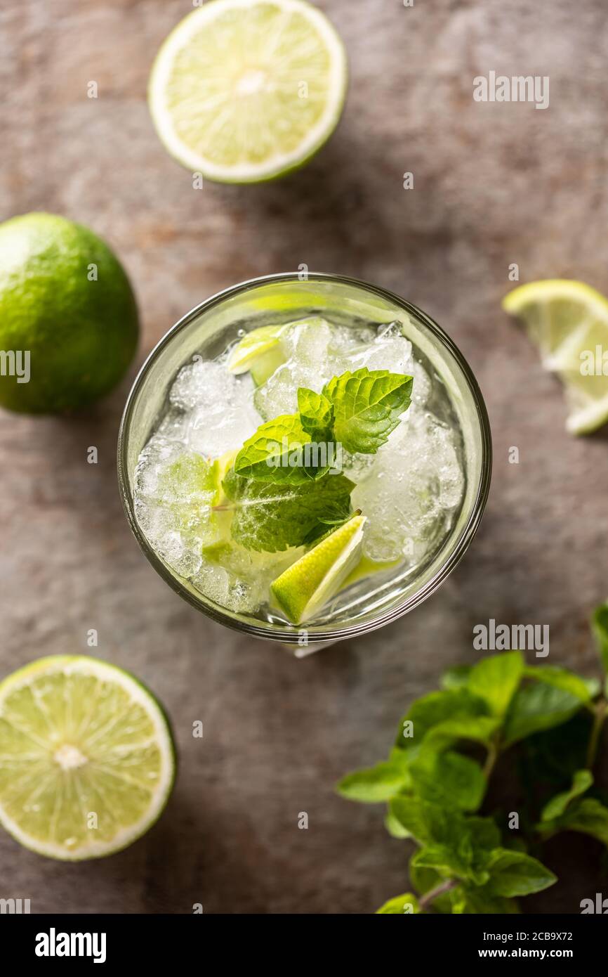 Mojito cocktail drink with white rum lime mint herbs and soda on the bar counter Stock Photo Alamy