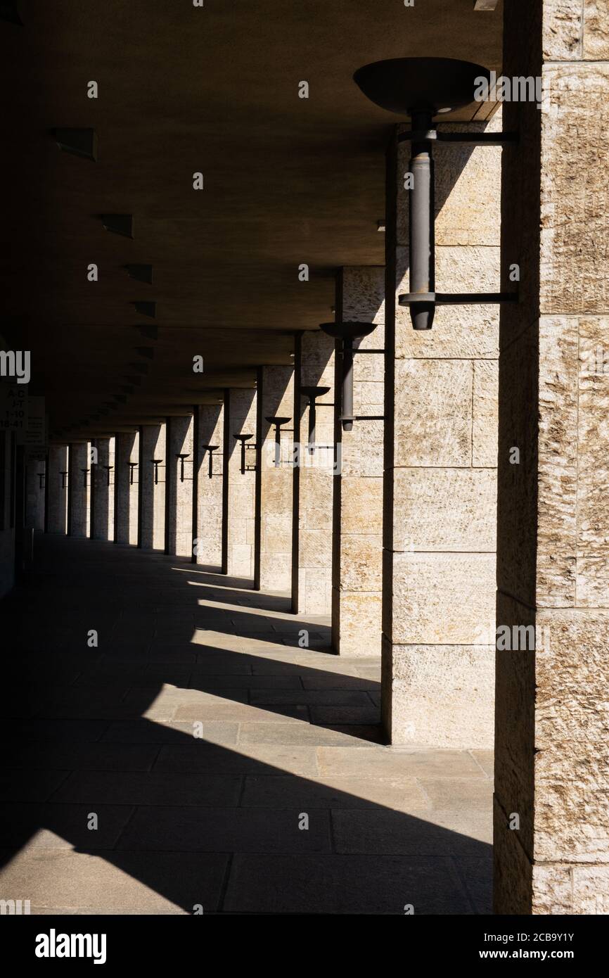 Classic Nazi architecture with line of pillars along corridor in Berlin Olympic Stadium Stock Photo
